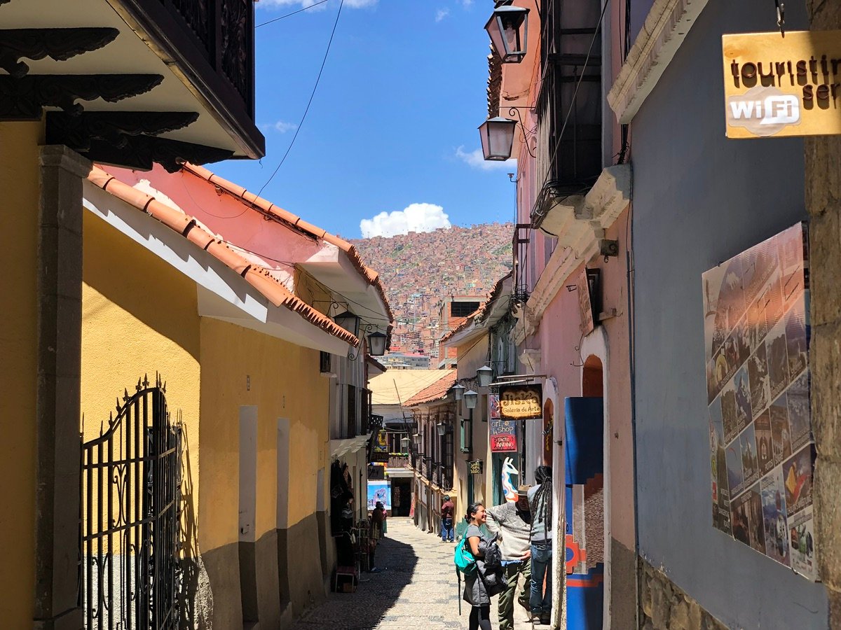 A closer look at the intricate balconies and historic streetlamps that adorn the buildings on Calle Jaén.