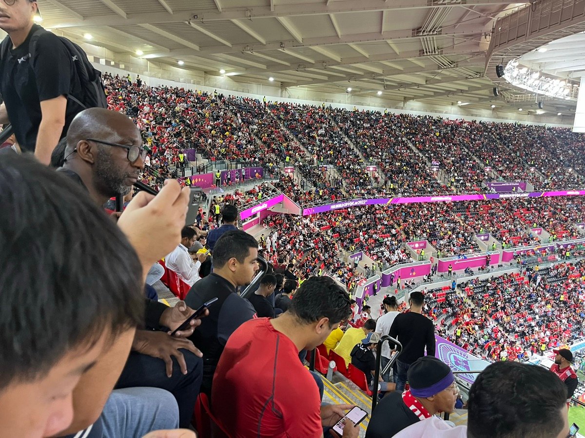An aerial view of Ahmad Bin Ali Stadium, showing the pitch and stands filled with spectators