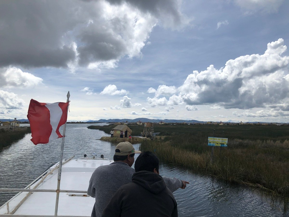 ALTO STOP sign along a waterway in the Uros Islands