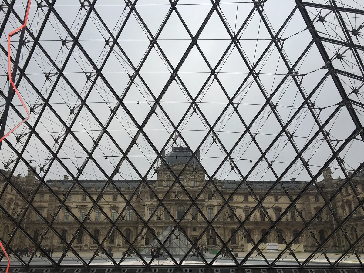 People in the plaza around the Louvre Pyramid