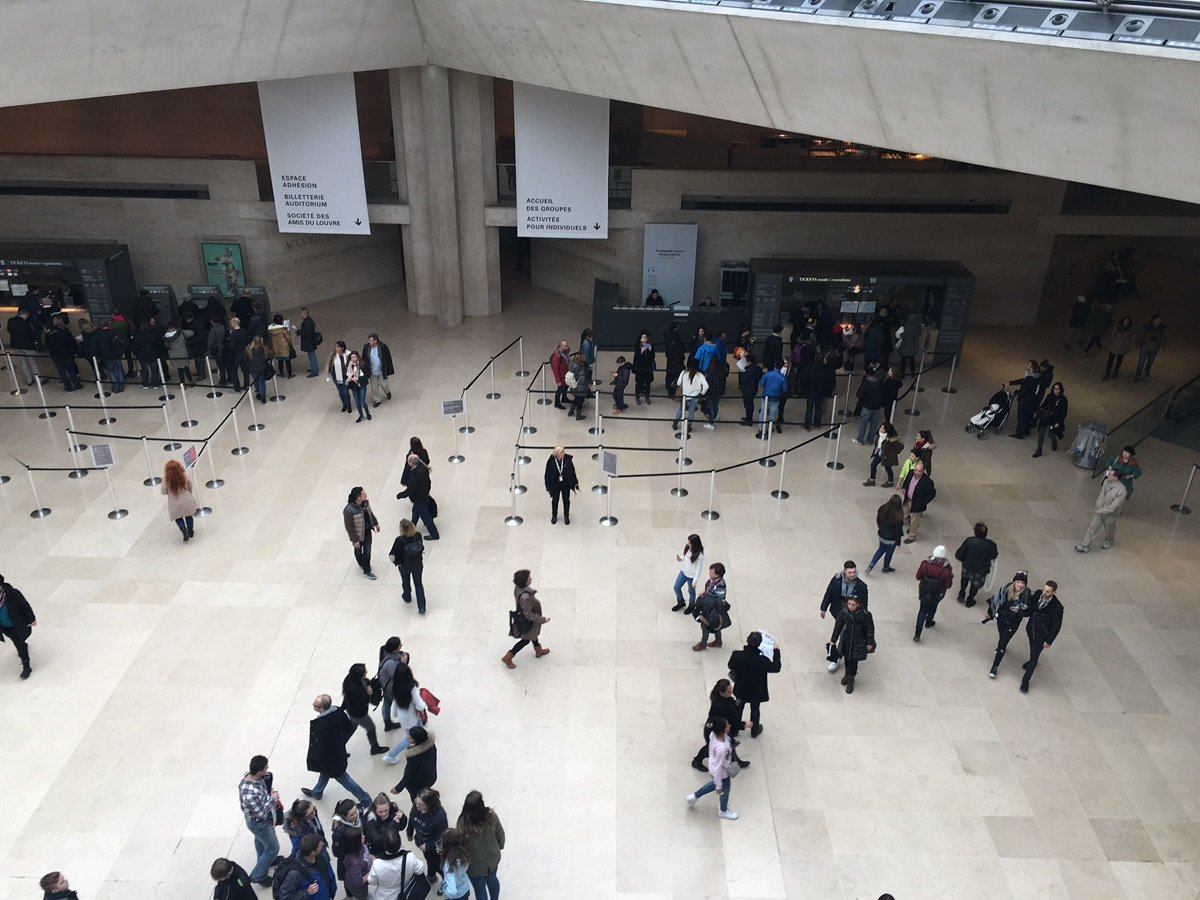 The Louvre Pyramid against the historic palace