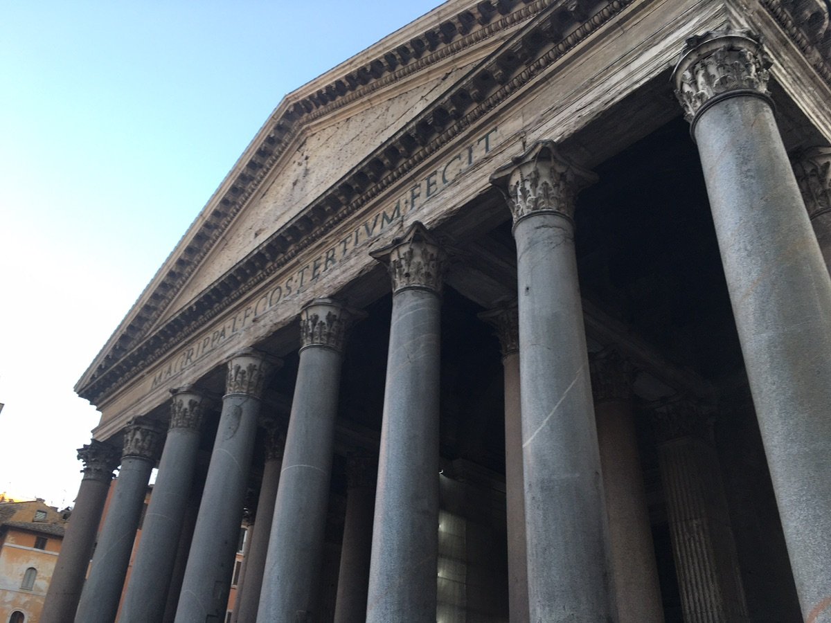 People looking up at the Pantheon dome ceiling