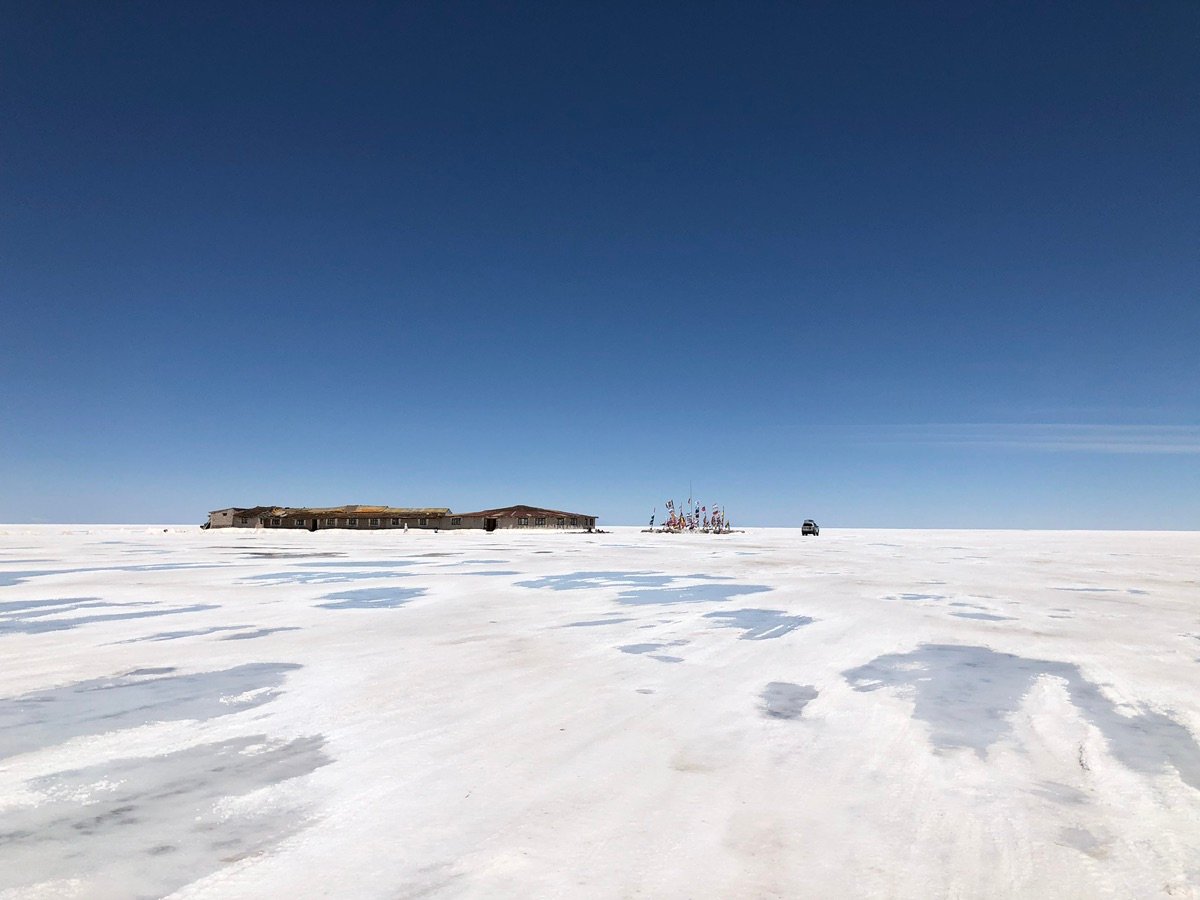 Patterns on the salt flat with distant mountains
