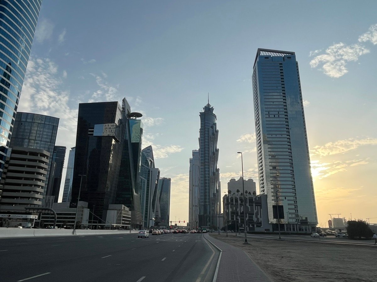 A trio of Dubai skyscrapers: Central Park Towers with its unique top, the wavy Sky Gardens, and the sleek Park Place Tower.
