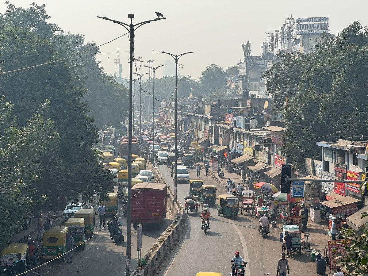 Auto-rickshaws and people on the street
