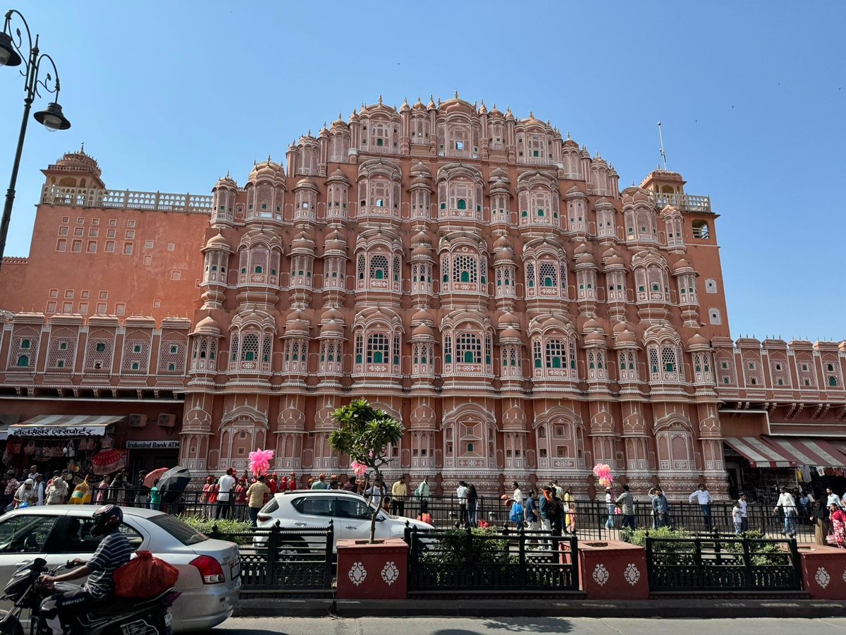 Looking up at the famous pink facade of Hawa Mahal in Jaipur.
