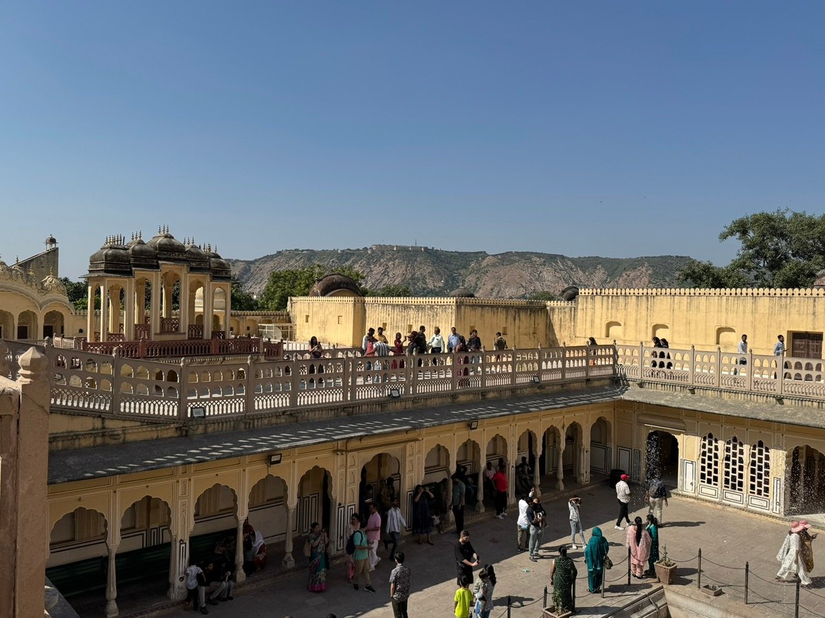 Tourists explore the courtyard and terraces of Hawa Mahal in Jaipur.
