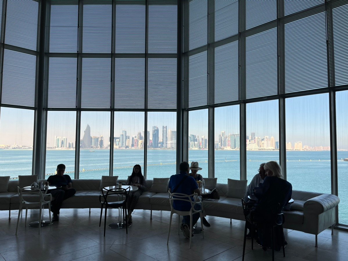 Relaxing at the MIA Café with a view of the Doha skyline.